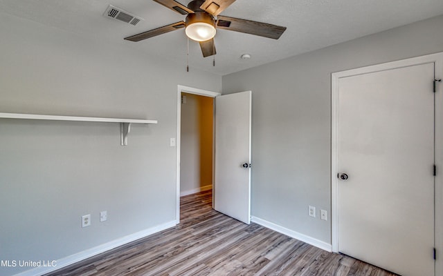 118 Bellegrove Blvd, Brandon, MS 39047 - unfurnished bedroom with a ceiling fan, baseboards, visible vents, and wood finished floors