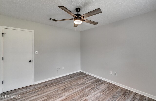 118 Bellegrove Blvd, Brandon, MS 39047 - unfurnished room featuring visible vents, wood finished floors, baseboards, ceiling fan, and a textured ceiling