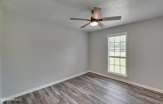 118 Bellegrove Blvd, Brandon, MS 39047 - unfurnished room with baseboards, ceiling fan, a textured ceiling, and wood finished floors
