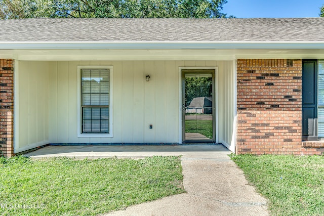 118 Bellegrove Blvd, Brandon, MS 39047 - entrance to property featuring roof with shingles, a lawn, and brick siding