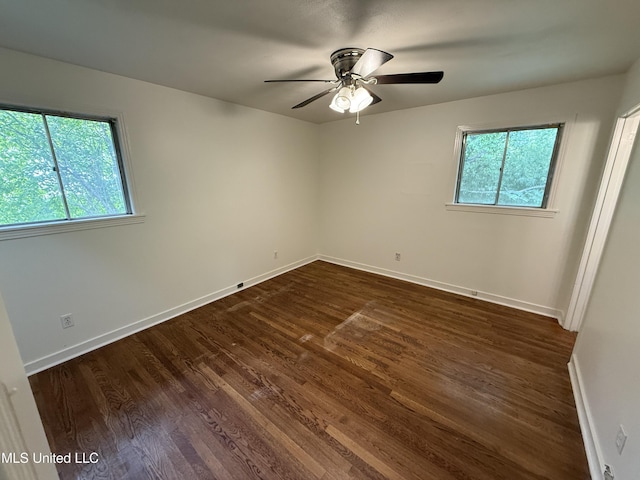 1632 Winchester St, Jackson, MS 39211 - empty room with dark wood-type flooring, baseboards, and ceiling fan
