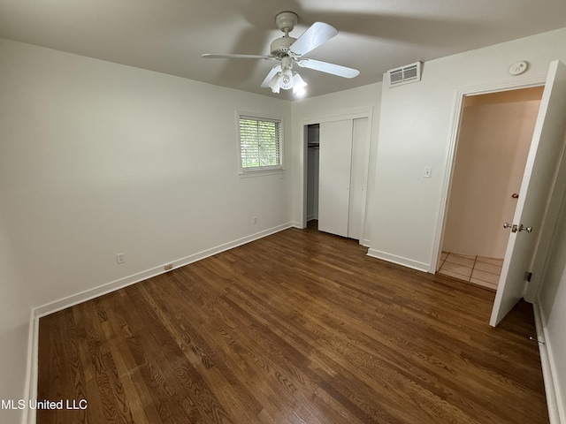 1632 Winchester St, Jackson, MS 39211 - unfurnished bedroom featuring wood finished floors, a closet, baseboards, and a ceiling fan