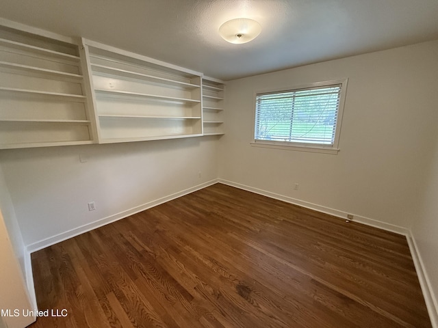 1632 Winchester St, Jackson, MS 39211 - empty room featuring dark wood finished floors and baseboards