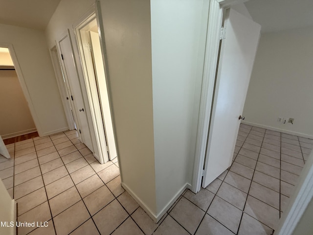 1632 Winchester St, Jackson, MS 39211 - hallway featuring light tile patterned floors and baseboards