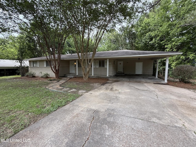 1632 Winchester St, Jackson, MS 39211 - ranch-style house with concrete driveway, a front lawn, and a carport