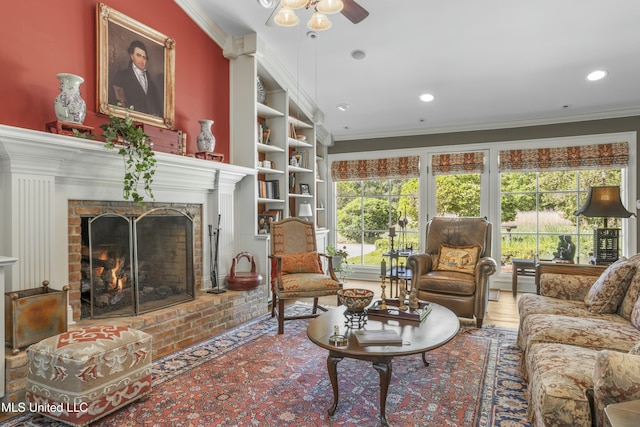 2629 Park View Dr, Biloxi, MS 39531 - living room with ornamental molding, a ceiling fan, a fireplace, recessed lighting, and built in shelves