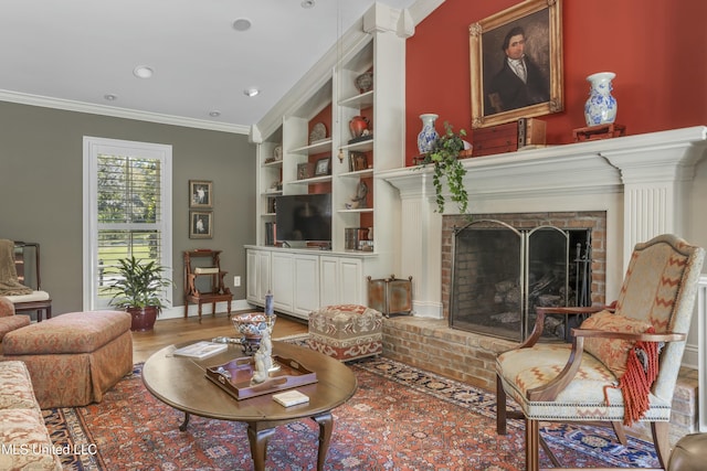 2629 Park View Dr, Biloxi, MS 39531 - living room with a brick fireplace, crown molding, wood finished floors, built in features, and recessed lighting