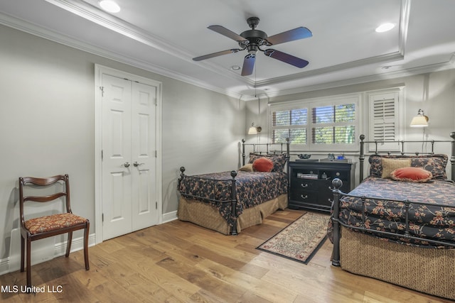 2629 Park View Dr, Biloxi, MS 39531 - bedroom with a tray ceiling, ornamental molding, wood finished floors, recessed lighting, and a ceiling fan