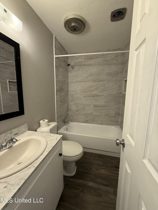 448 Ruston St, Pearl, MS 39208 - full bathroom featuring vanity, wood finished floors, shower / bath combination, and a textured ceiling