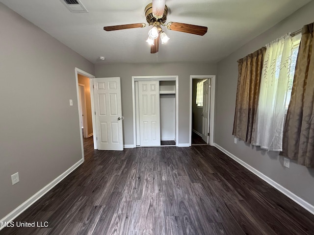 448 Ruston St, Pearl, MS 39208 - unfurnished bedroom featuring dark wood-style flooring, a closet, and ceiling fan