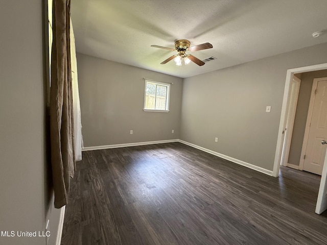 448 Ruston St, Pearl, MS 39208 - empty room featuring a ceiling fan, dark wood-style floors, and a smoke detector