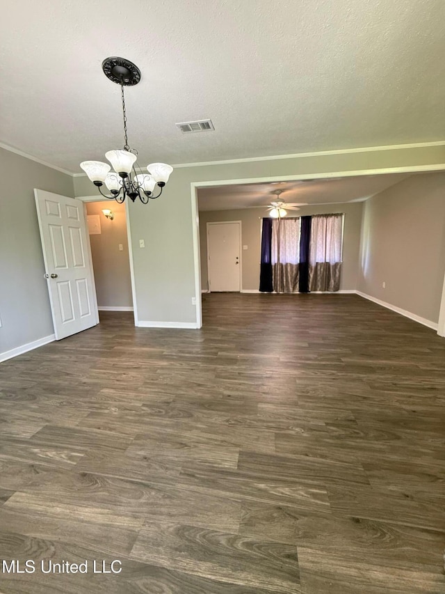 448 Ruston St, Pearl, MS 39208 - empty room with a chandelier, dark wood-type flooring, ornamental molding, and a textured ceiling