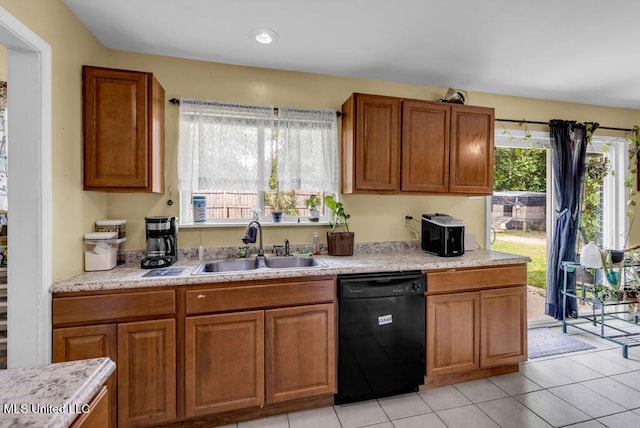 615 Baker St, Wiggins, MS 39577 - kitchen with black dishwasher, a sink, light countertops, and healthy amount of natural light