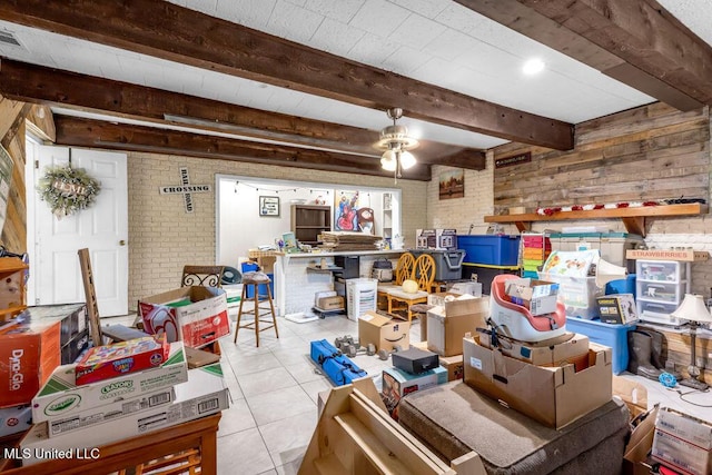 615 Baker St, Wiggins, MS 39577 - basement with brick wall, a ceiling fan, and tile patterned floors