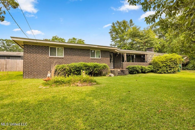 615 Baker St, Wiggins, MS 39577 - single story home with brick siding and a chimney