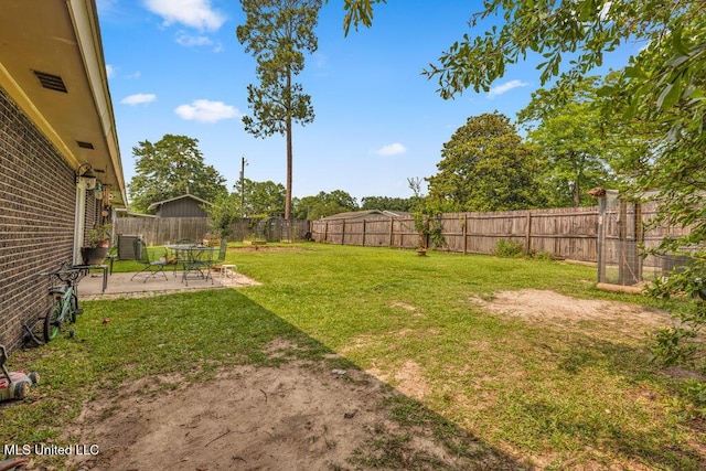 615 Baker St, Wiggins, MS 39577 - view of yard with a patio