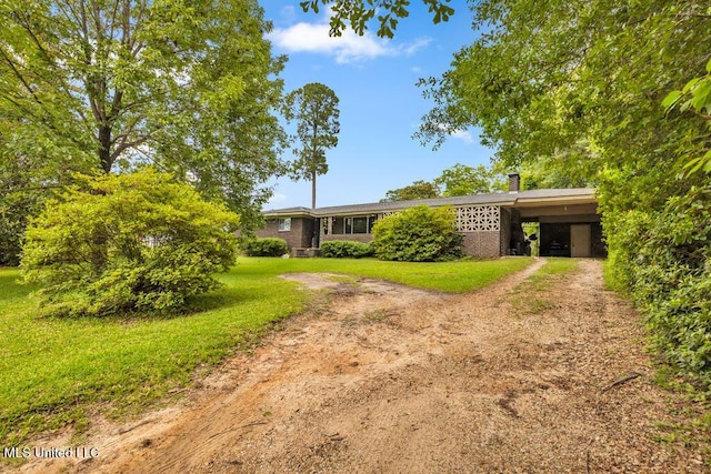 615 Baker St, Wiggins, MS 39577 - view of front of property featuring driveway, a front lawn, and a chimney