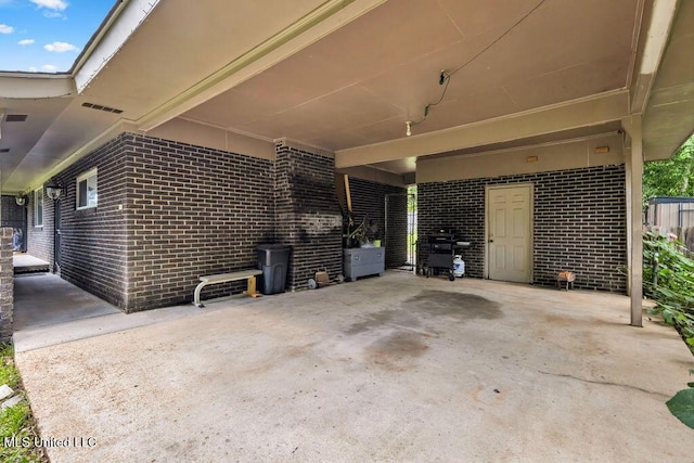 615 Baker St, Wiggins, MS 39577 - view of patio / terrace with an attached carport and area for grilling