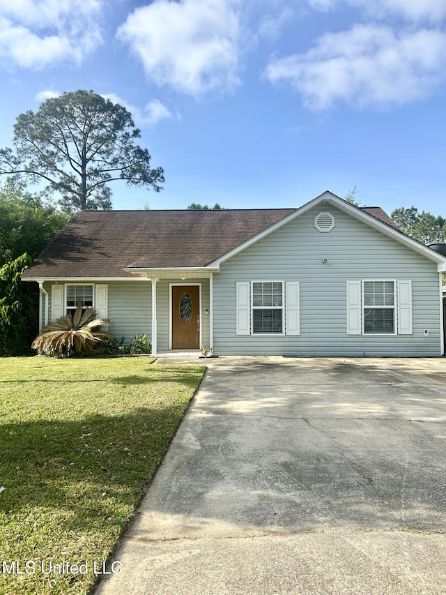 single story home featuring concrete driveway and a front yard