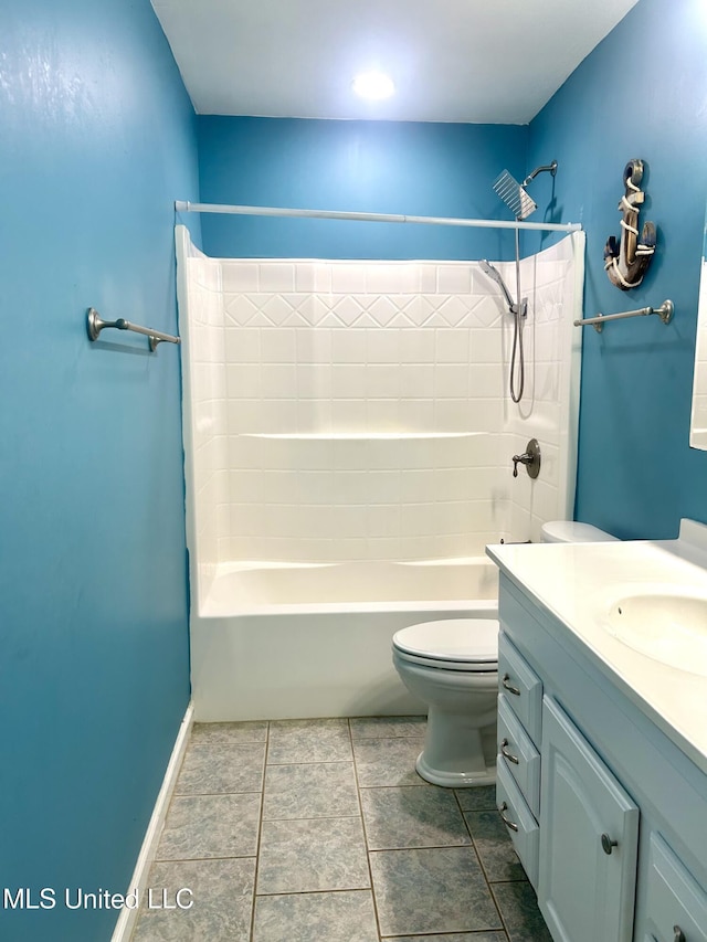 bathroom with tile patterned floors, toilet,  shower combination, and vanity