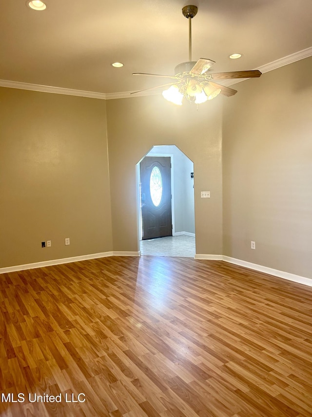 bonus room featuring baseboards, arched walkways, recessed lighting, wood finished floors, and a ceiling fan