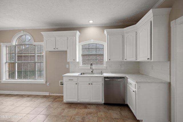 kitchen with dishwasher, backsplash, a sink, and white cabinets