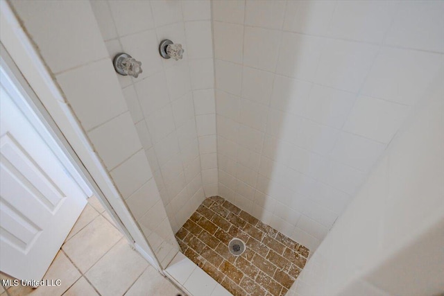 bathroom with a shower stall