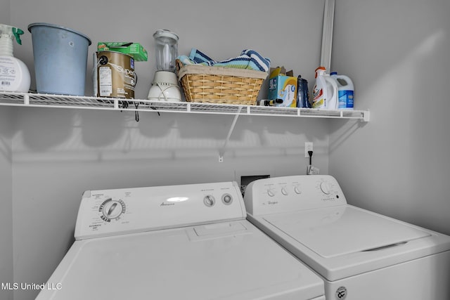 clothes washing area with laundry area and washing machine and clothes dryer