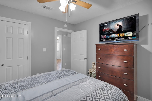 bedroom with visible vents and a ceiling fan