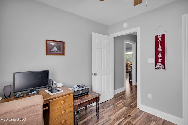 home office featuring a ceiling fan, wood finished floors, and baseboards