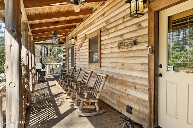 view of patio featuring ceiling fan, a grill, and a porch