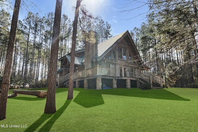 exterior space with a yard and a deck