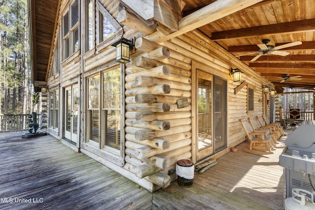 wooden deck with grilling area and ceiling fan