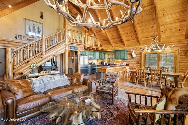 living room featuring rustic walls, an inviting chandelier, high vaulted ceiling, wooden ceiling, and beamed ceiling