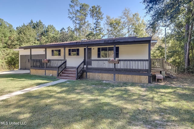 view of front of property with a front lawn and a wooden deck