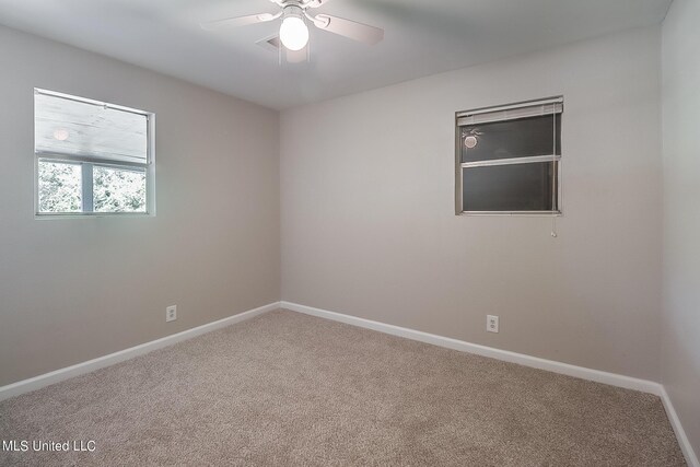 6533 Shawnee St, Kiln, MS 39556 - carpeted empty room with ceiling fan and baseboards