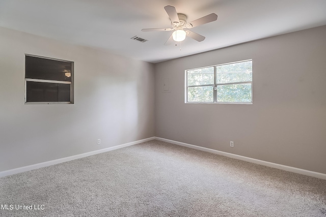 spare room with carpet flooring and ceiling fan