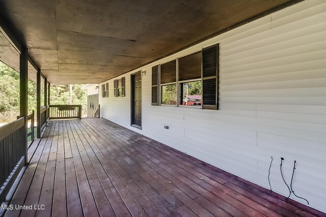 6533 Shawnee St, Kiln, MS 39556 - wooden deck with covered porch