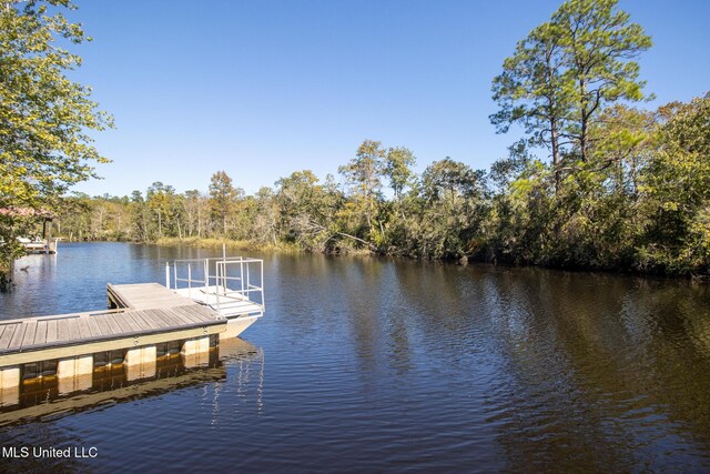 6533 Shawnee St, Kiln, MS 39556 - dock area featuring a water view and a wooded view