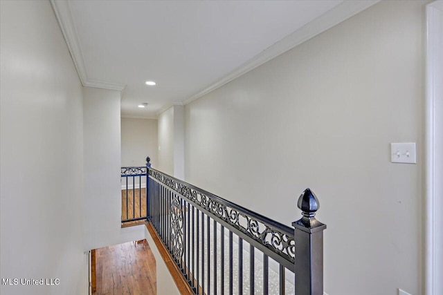 hall with crown molding and hardwood / wood-style floors