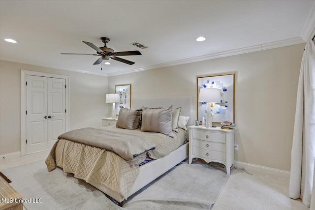 bedroom with crown molding, light colored carpet, and ceiling fan