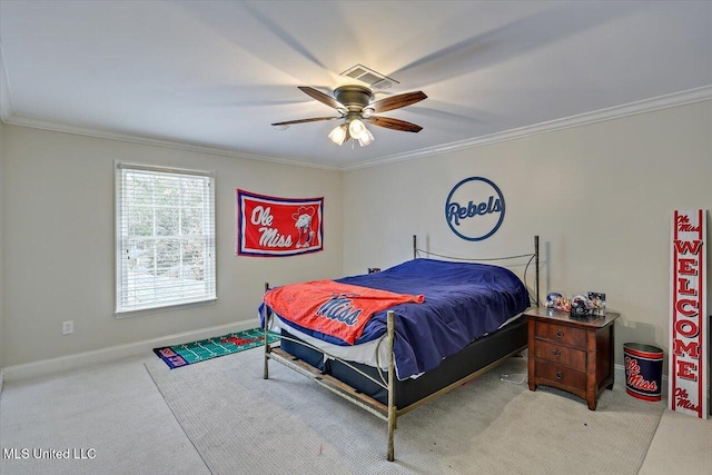 bedroom with ceiling fan, ornamental molding, and carpet