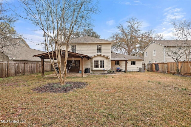 rear view of property with a lawn