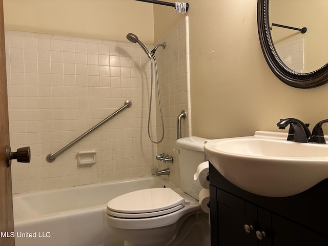 full bathroom featuring vanity, toilet, and tiled shower / bath combo