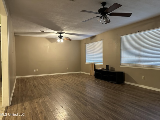 interior space featuring dark hardwood / wood-style flooring and a textured ceiling