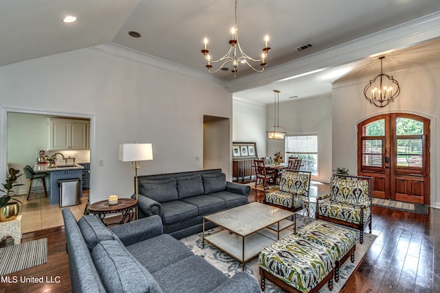 865 Wellington Way, Madison, MS 39110 - living room with a chandelier, crown molding, dark wood-type flooring, vaulted ceiling, and recessed lighting
