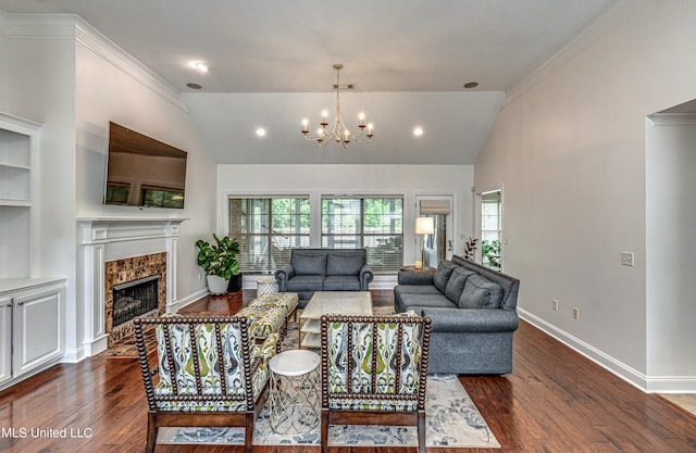 865 Wellington Way, Madison, MS 39110 - living room featuring a fireplace, dark wood-style flooring, a chandelier, baseboards, and ornamental molding
