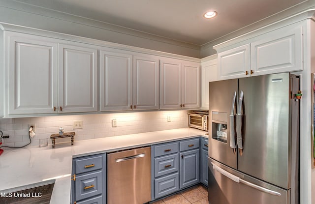 865 Wellington Way, Madison, MS 39110 - kitchen with stainless steel appliances, white cabinetry, light countertops, backsplash, and recessed lighting