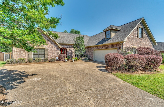 865 Wellington Way, Madison, MS 39110 - view of front of house with roof with shingles, brick siding, driveway, and a garage