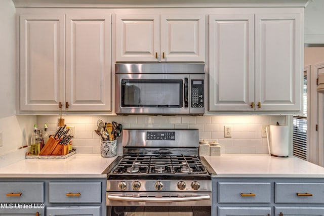 865 Wellington Way, Madison, MS 39110 - kitchen featuring appliances with stainless steel finishes, gray cabinets, decorative backsplash, and light countertops